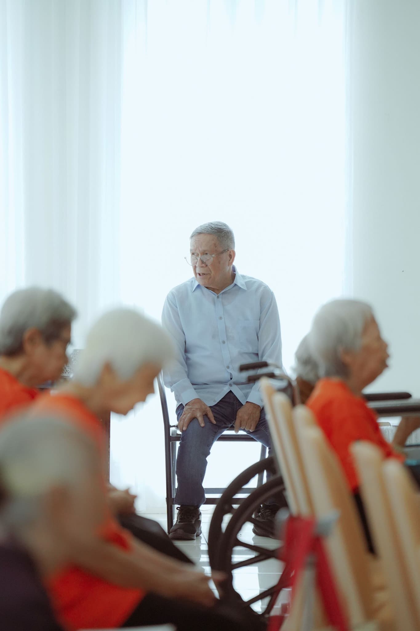 An older adult taking part in a community gathering